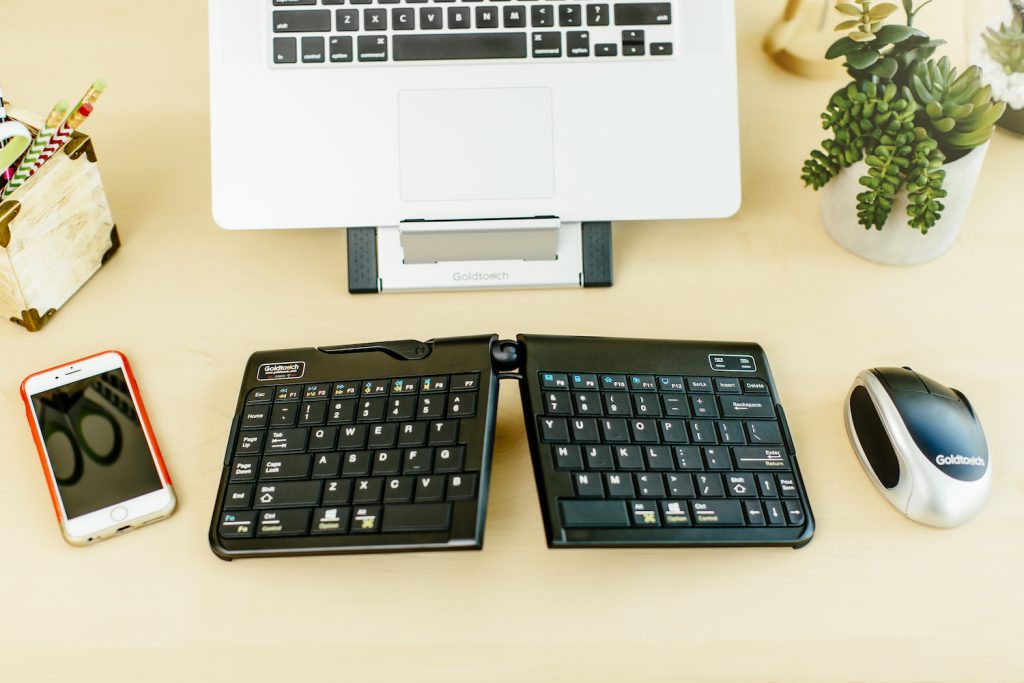 well balanced workspace - keyboard, mouse, mobile phone and tablet on tablet stand
