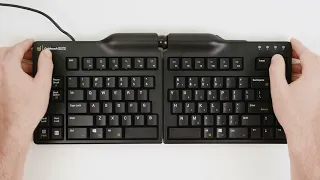 Goldtouch Elite Keyboard thumbnail showing a man holding the keyboard.